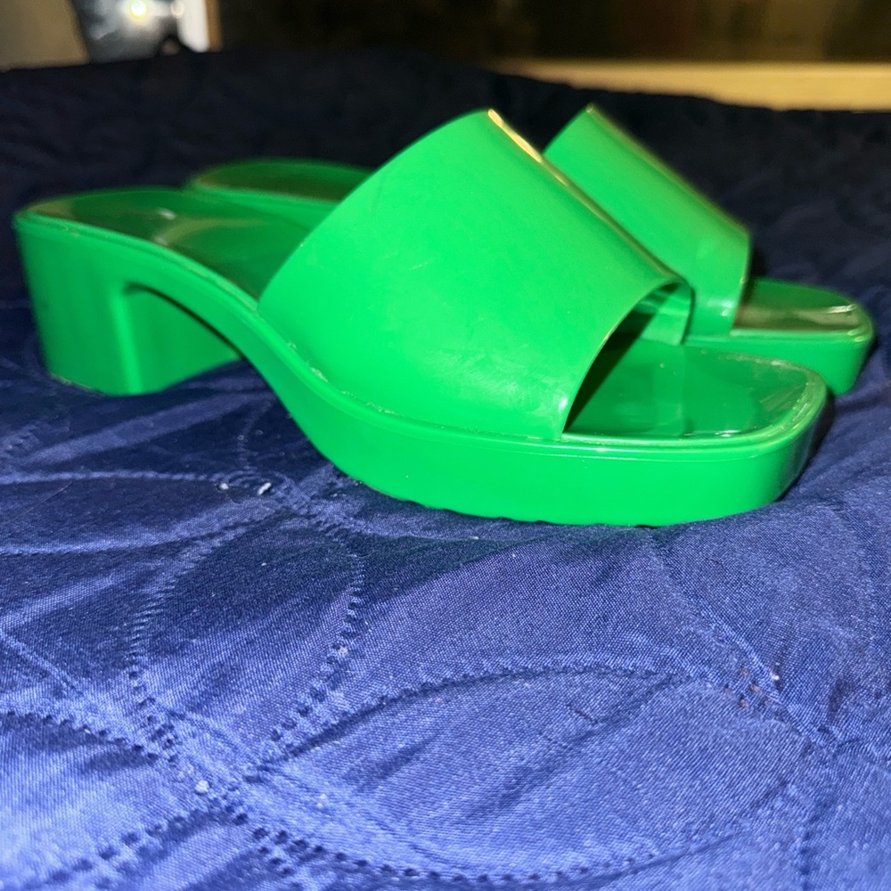 Never worn. Green slip on jelly sandals low heel
